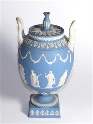 Lot 318 - A Wedgwood blue Jasper ware urn and cover decorated in the Classical taste with the Greek muses...