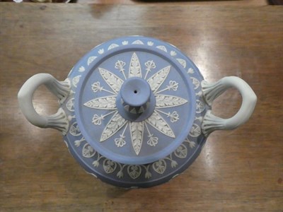 Lot 318 - A Wedgwood blue Jasper ware urn and cover decorated in the Classical taste with the Greek muses...