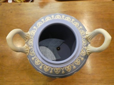 Lot 318 - A Wedgwood blue Jasper ware urn and cover decorated in the Classical taste with the Greek muses...