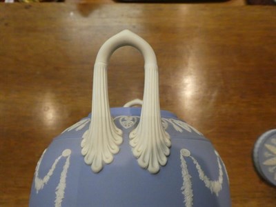 Lot 318 - A Wedgwood blue Jasper ware urn and cover decorated in the Classical taste with the Greek muses...