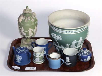 Lot 334 - A group of Wedgwood Jasper ware including a vase, urn and cover, twin handled cups etc