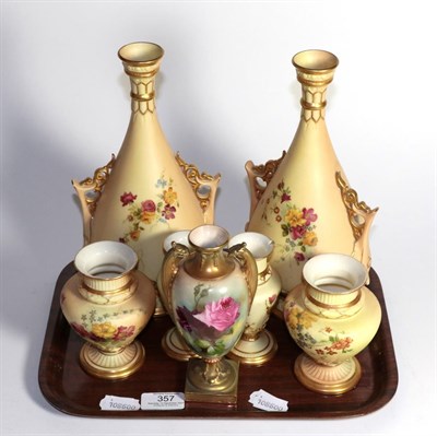 Lot 357 - A pair of Royal Worcester blush ivory twin handled vases, two further pairs of Royal Worcester...