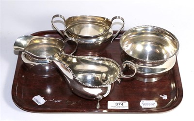 Lot 374 - Silver cream and sugar, silver sauce boat and silver bowl, 15ozt