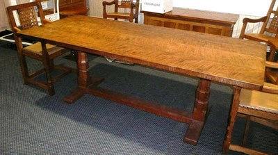 Lot 1622 - A Robert "Mouseman" Thompson 7' Four-Plank Oak Refectory Table, on two octagonal legs, joined...