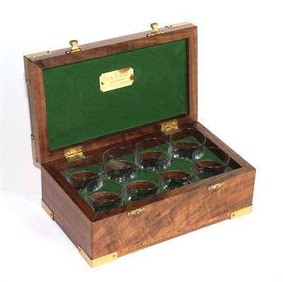 Lot 377 - An inlaid and brass mounted boxwood hinged box with fitted interior, housing eight numbered...