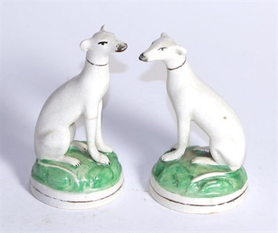 Lot 401 - A pair of 19th century Staffordshire seated grey hounds, 11cm high