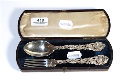 Lot 418 - A silver spoon and fork set, by George Adams, London, cased