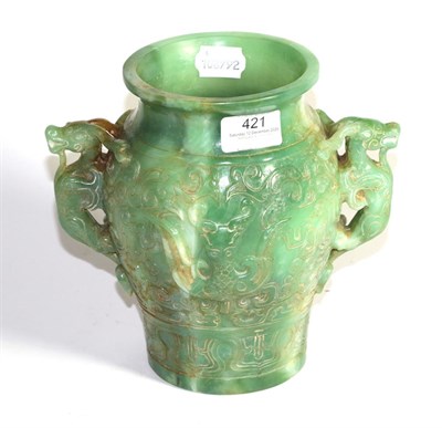 Lot 421 - A carved green hardstone twin-handled vase with Oriental design, 20cm high