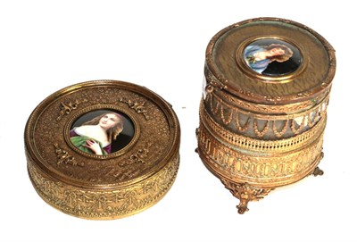 Lot 423 - A brass trinket box with musical movement and another box, each set with a porcelain plaque,...