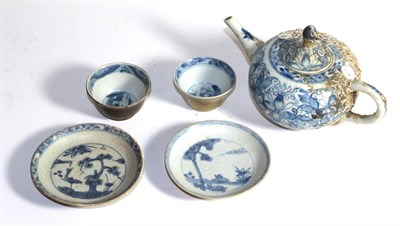 Lot 427 - A Chinese teapot from the Camau ship wreck, circa 1730 and two tea bowls and saucers