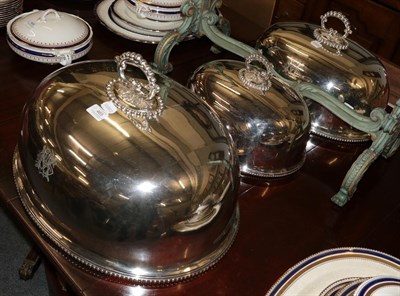 Lot 465 - A graduated set of silver plated meat domes with beaded handle and rim, each engraved with a...