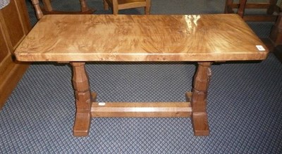 Lot 1631 - A Robert "Mouseman" Thompson Burr Oak 3' Coffee Table, on two octagonal legs joined by a...