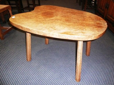 Lot 1634 - A Robert "Mouseman" Thompson Burr Oak Kidney Coffee Table, on four octagonal legs, with...