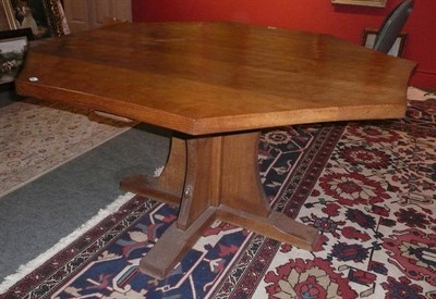 Lot 1635 - A Robert "Mouseman" Thompson Oak Octagonal Dining Table, on a cruciform base, with carved mouse...