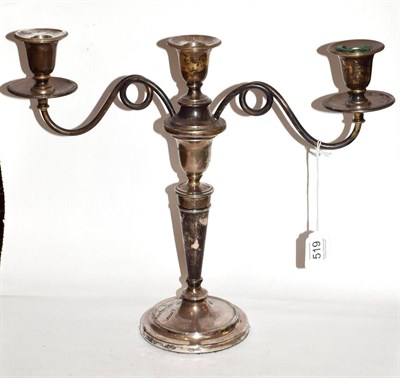 Lot 519 - A George VI silver three-light candelabrum, by Israel Freeman & Son Ltd., London, 1942, on circular