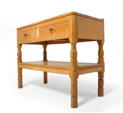 Lot 1636 - A Robert "Mouseman" Thompson Oak Hall Table, the raised upstand above two drawers with...