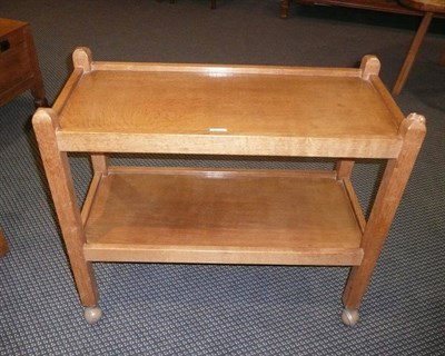 Lot 1637 - A Robert "Mouseman" Thompson Oak Tea Trolley, with two tiers both with raised sides joined by...