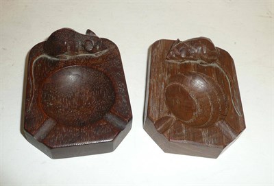 Lot 1638 - Two Robert "Mouseman" Thompson Oak Ashtrays, left and right handed craftsmen, each with a...