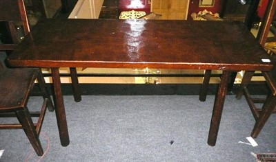 Lot 1650 - A Robert "Mouseman" Thompson Oak Pub Table, the adzed rectangular top on four tapering...