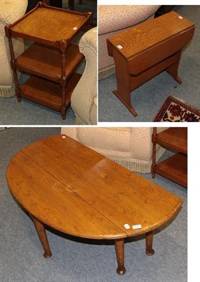 Lot 1177 - A reproduction oak drop leaf coffee table on pad feet, another oak drop leaf coffee table, a...
