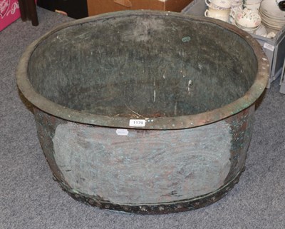 Lot 1179 - An oval copper riveted log bin, 70cm diameter