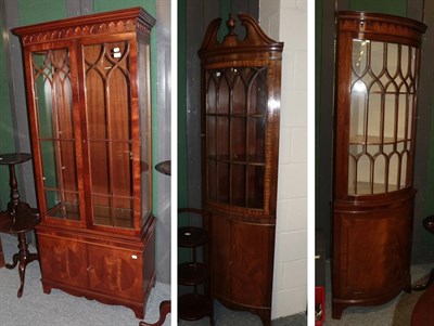 Lot 1180 - Two reproduction mahogany freestanding corner cupboards and a reproduction mahogany display cabinet