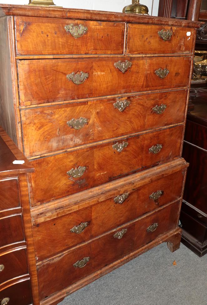 Lot 1203 - A George II walnut seven-drawer chest on