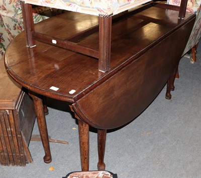 Lot 1214 - A 19th century oak wake table, 173cm by 143cm by 77cm