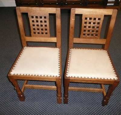 Lot 1660 - A Set of Eight Peter "Rabbitman" Heap Oak Lattice Back Dining Chairs, with upholstered seats,...