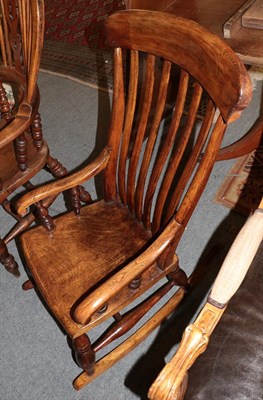 Lot 1216 - An early 19th century oak rocking chair