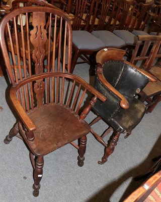 Lot 1225 - A 19th century elm smokers chair, and an oak and elm Windsor chair of similar date with...