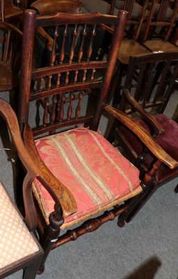 Lot 1227 - A 19th century elm open armchair