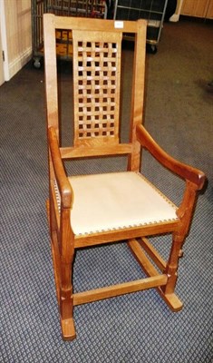 Lot 1662 - A Peter "Rabbitman" Heap Oak Rocking Chair, with lattice panel back, shaped arms, with carved...