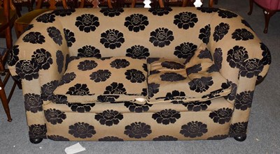 Lot 1237 - A Victorian Chesterfield settee, re-upholstered in black floral fabric, 141cm by 67cm by 71cm high