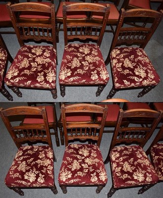 Lot 1239 - A set of early 20th century mahogany dining chairs with floral upholstered padded seats (6)