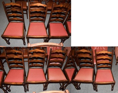 Lot 1240 - A set of seven reproduction ladder back dining chairs