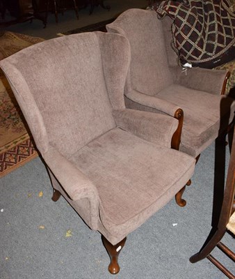Lot 1244 - A pair of Parker Knoll wingback armchairs (2)