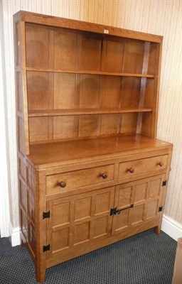 Lot 1663 - A Peter "Rabbitman" Heap Oak Dresser, the rack with two shelves, the base fitted with two...