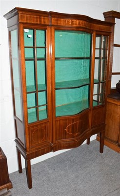 Lot 1258 - An Edwardian inlaid mahogany serpentine fronted display case, 123cm by 46cm by 176cm