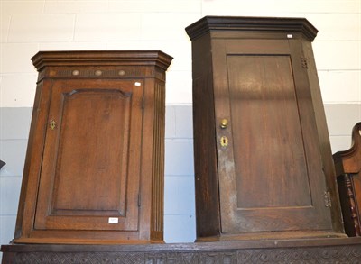 Lot 1271 - Two George III oak hanging corner cupboards