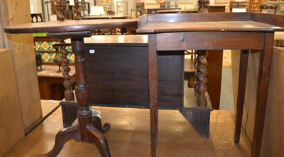 Lot 1278 - A George III oak tripod table, together with a small oak occasional table (2)