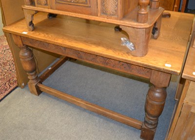 Lot 1283 - A carved oak refectory table with turned bulbous legs joined by an H-stretcher, 137cm by 90cm...