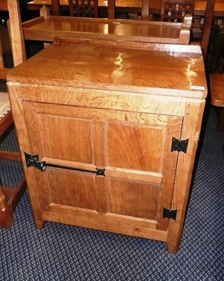 Lot 1667 - A Peter "Rabbitman" Heap Panelled Oak Record Cabinet, with raised upstand above a door...