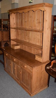 Lot 1287 - A pine farm house dresser, 153cm by 54cm by 200cm