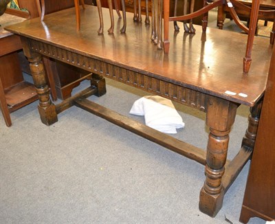 Lot 1289 - A Titchmarsh & Goodwin style oak refectory table with trestle base, 168cm by 71cm by 76cm