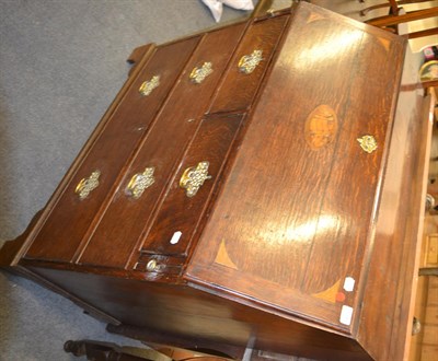 Lot 1295 - An 18th century inlaid oak bureau, the fall front with central shell pattera within conforming...