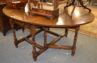 Lot 1297 - A Titchmarsh & Goodwin gate-leg oak dining table, 183cm by 130cm by 75cm