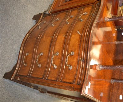 Lot 1299 - A reproduction mahogany serpentine fronted four height bachelors chest with dressing slide, 71cm by