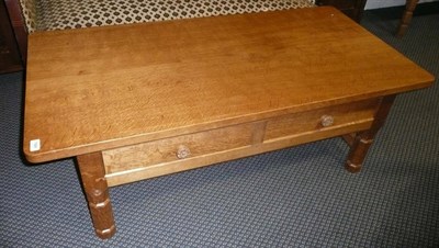 Lot 1669 - A Malcolm "Foxman" Pipes Oak Low Rectangular Coffee Table, fitted with two drawers each with a...