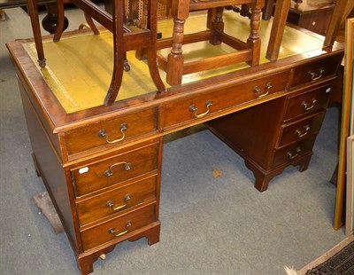 Lot 1319 - A 20th century mahogany leather inset pedestal desk, 140cm by 77cm by 77cm high